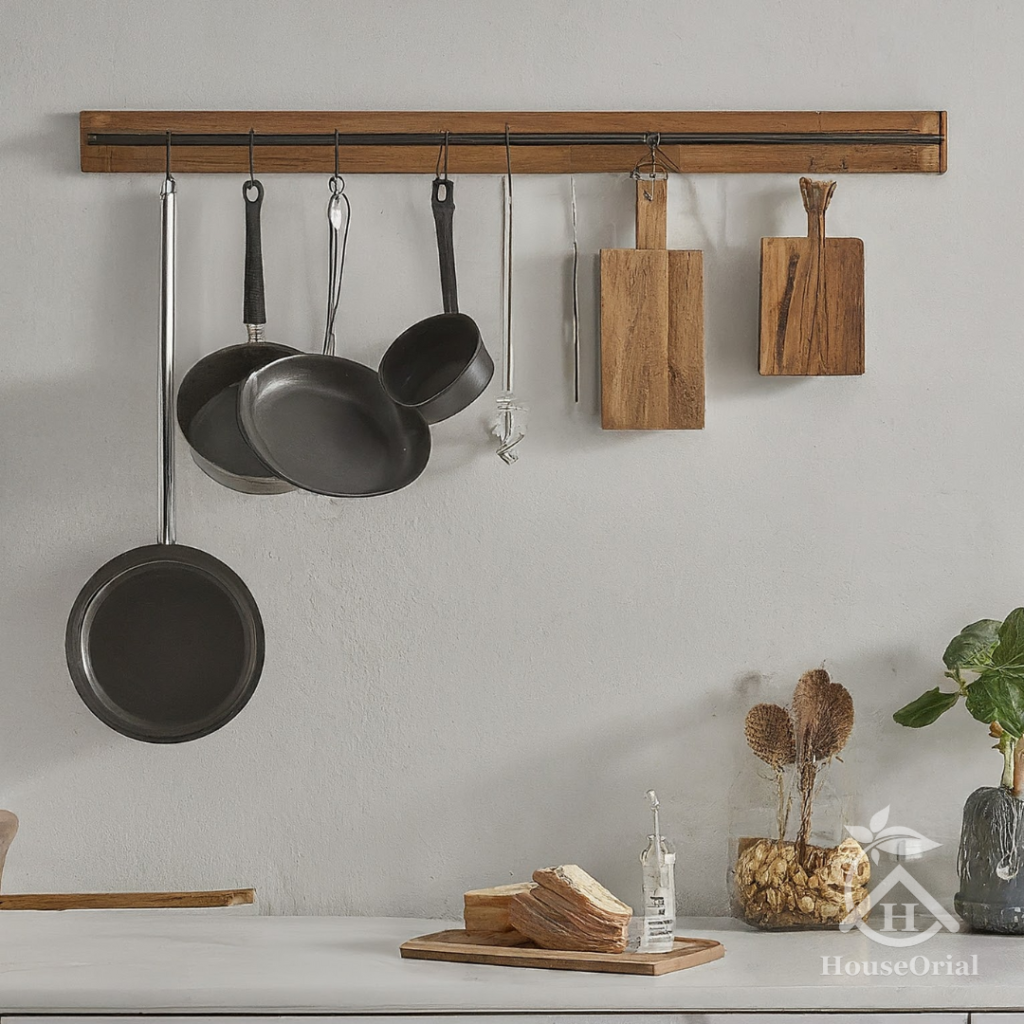 Under-cabinet hooks holding mugs, utensils and potholders in small kitchen counter organization